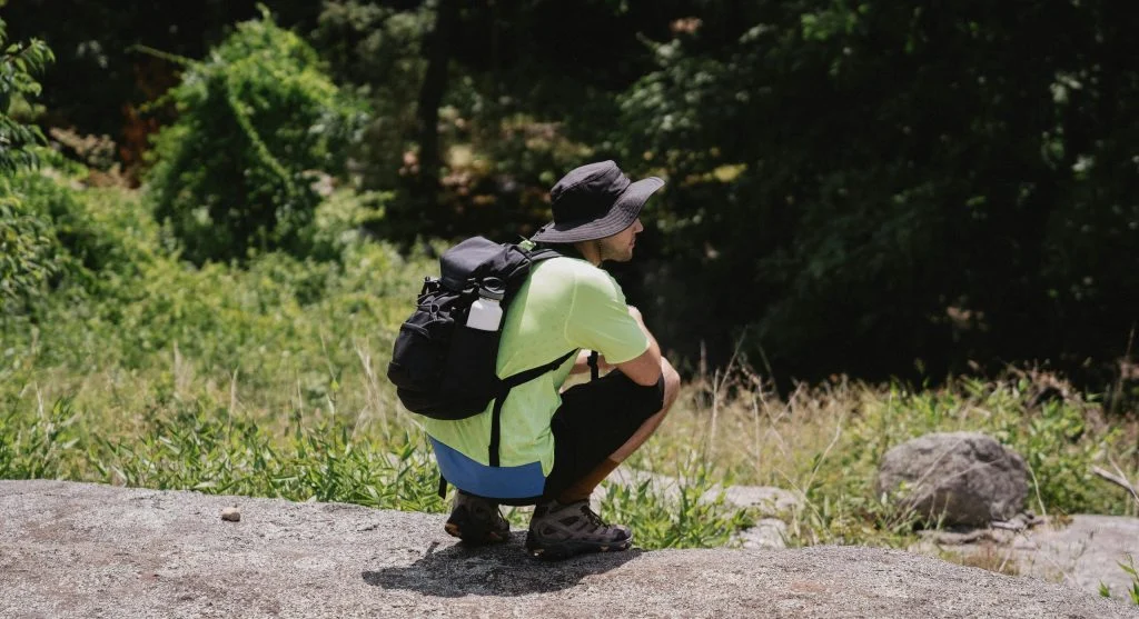 Hiker watching animals from a distance on a spring hiking trail